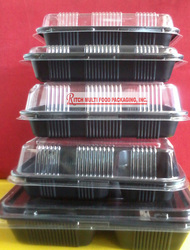 Bento boxes arranged vertically, one top of each other, black color bento with clear lid